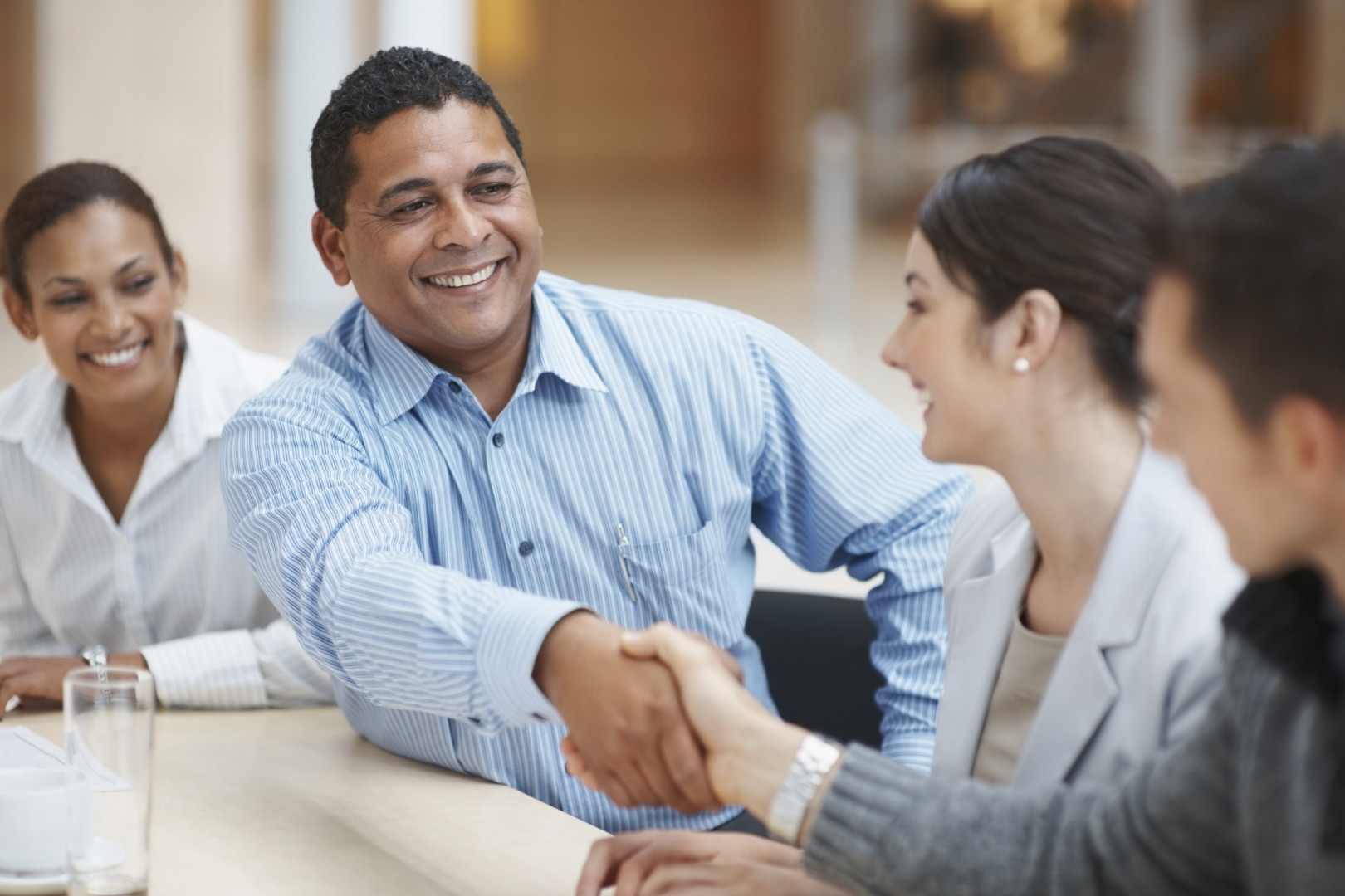 Man shaking hands in a group